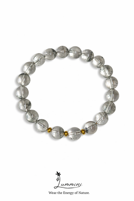 Bracelet with clear beads on a white background, featuring the brand 'Luminari'.
