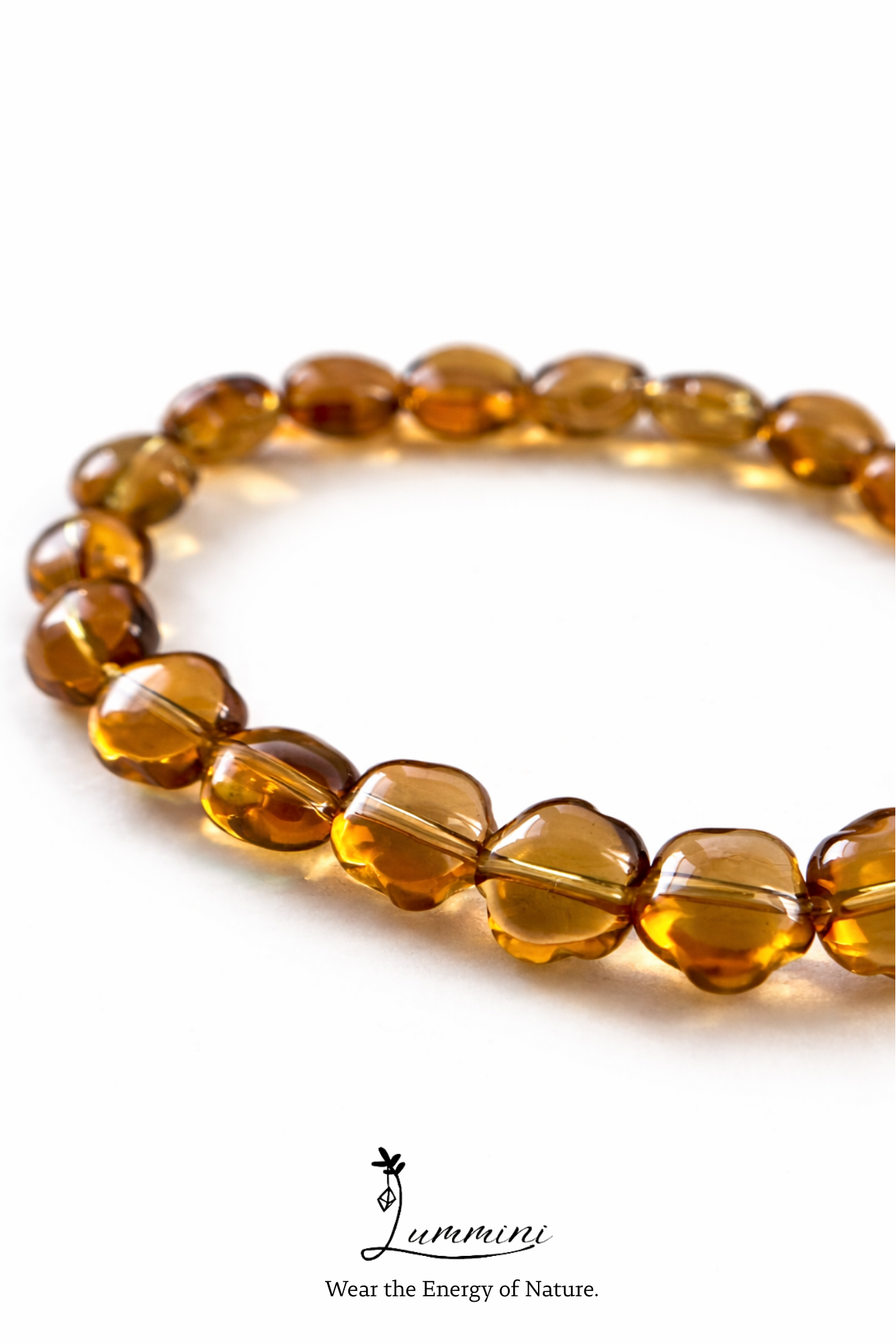 Brown beaded bracelet on a white background with 'Luminari' branding.