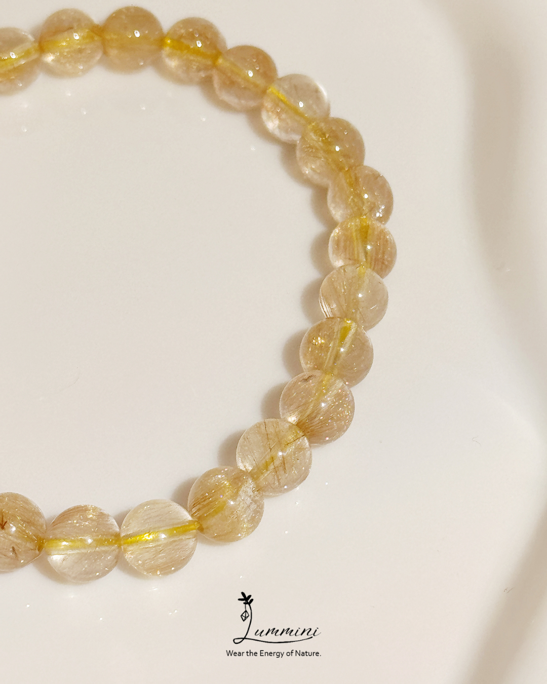 Beaded bracelet with yellow beads on a white background, featuring the brand 'Lumimni'.