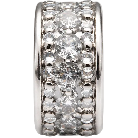 Silver ring with clear gemstones on a white background